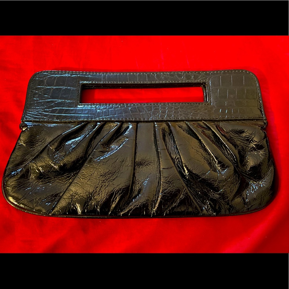 Black Patent Leather Clutch with animal print lining. Great condition!